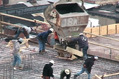 image of workers on a building installing a concrete frame